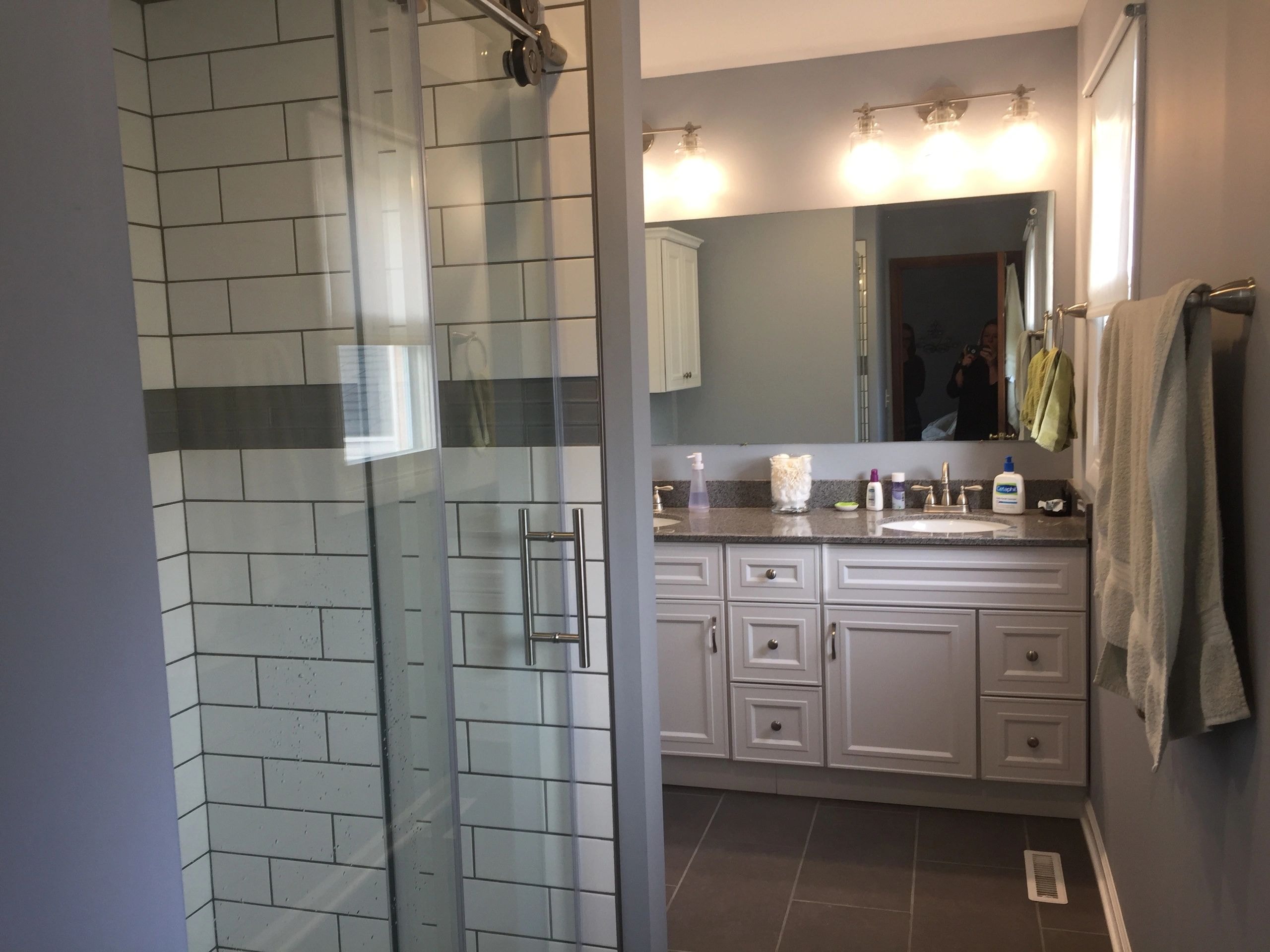 Spa-inspired bathroom with freestanding bathtub and warm tile accents